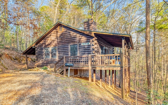 57 Coffee Pot Dr, Blue Ridge, GA 30513 - view of front facade featuring a chimney, a wooden deck, and log exterior