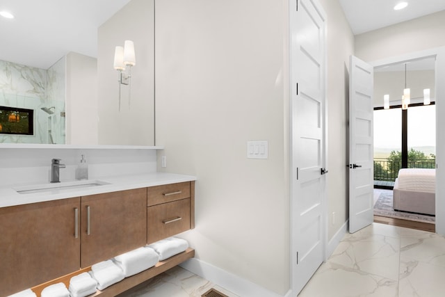 bathroom featuring walk in shower and vanity