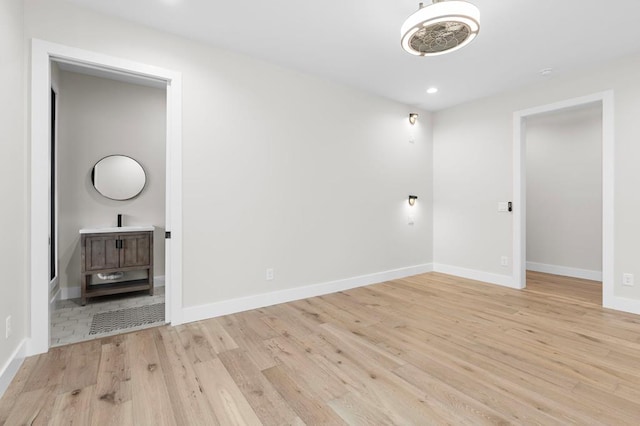 empty room with light hardwood / wood-style floors