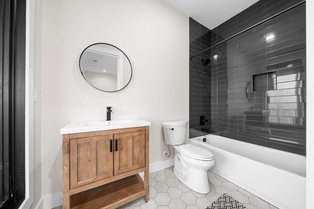 full bathroom with vanity, tile patterned floors, toilet, and tiled shower / bath