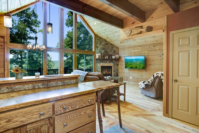 living room featuring wood ceiling, high vaulted ceiling, and light hardwood / wood-style flooring