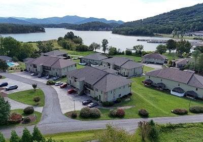 bird's eye view with a water and mountain view