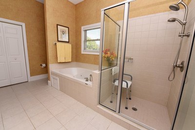 bathroom with shower with separate bathtub and tile patterned floors