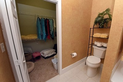 bathroom featuring tile patterned flooring and toilet