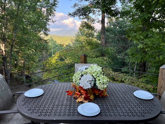 149 Poormans Trl, Murphy, NC 28906 - view of patio with outdoor dining space and a forest view