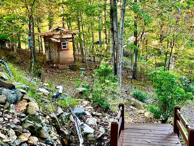 149 Poormans Trl, Murphy, NC 28906 - view of yard featuring a forest view and an outbuilding
