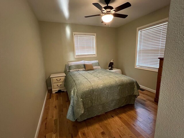 bedroom featuring ceiling fan and light hardwood / wood-style flooring