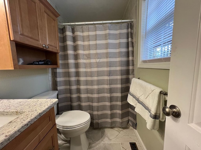 bathroom with toilet and vanity