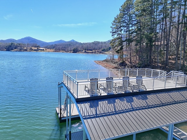 dock area featuring a water and mountain view