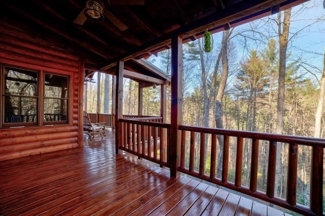 wooden terrace featuring a sunroom
