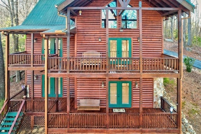 exterior space featuring french doors and a deck
