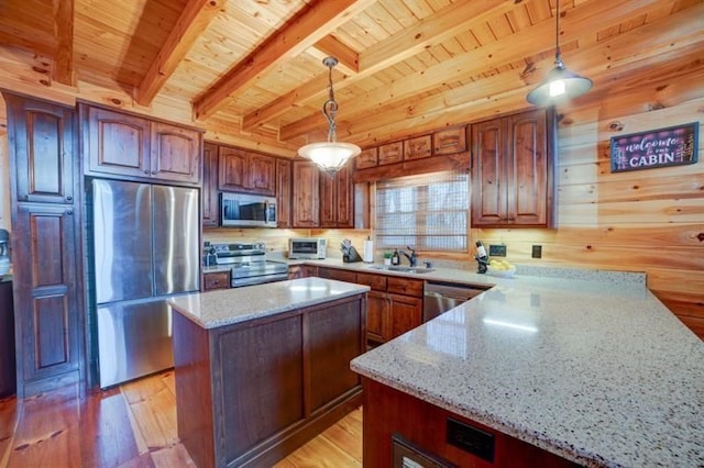 kitchen with appliances with stainless steel finishes, wooden ceiling, light stone counters, and light wood finished floors