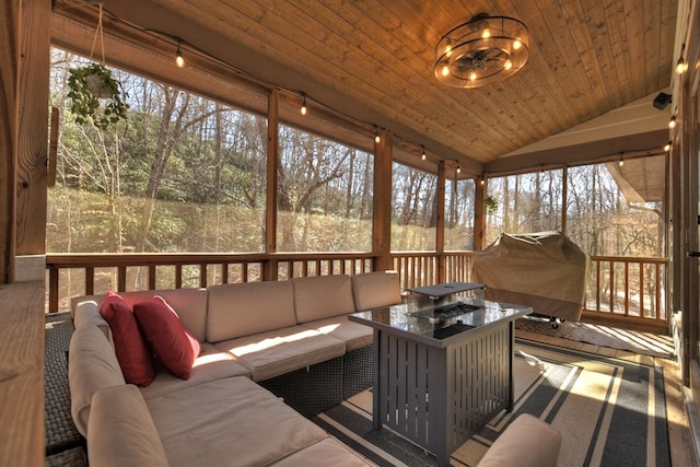 sunroom with wood ceiling and lofted ceiling