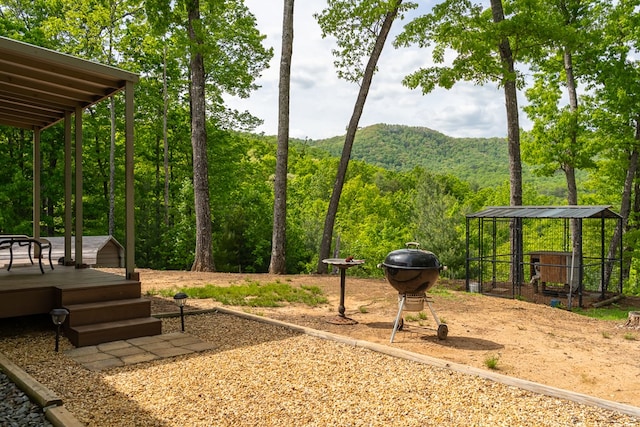 exterior space with a deck with mountain view