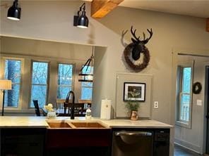 bar with sink, dishwasher, and lofted ceiling