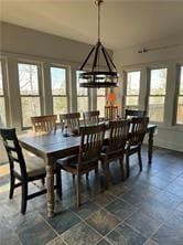 dining room with a notable chandelier