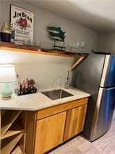 kitchen with sink and stainless steel fridge