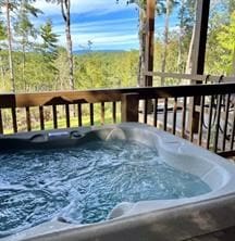 deck with a hot tub