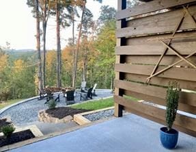 view of home's community featuring a patio and a fire pit