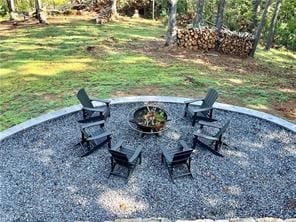 view of patio with a fire pit