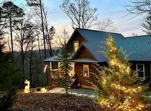 view of front facade with an outdoor fire pit