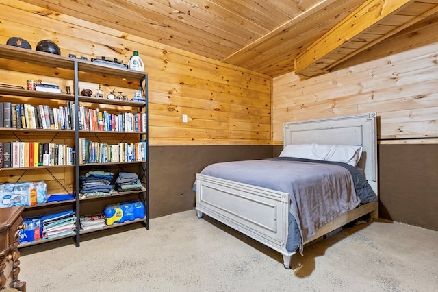 bedroom with wooden ceiling and wood walls