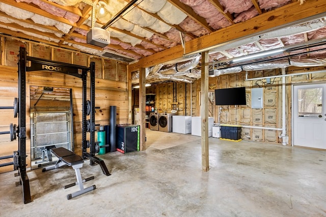 basement featuring washer and clothes dryer and electric panel