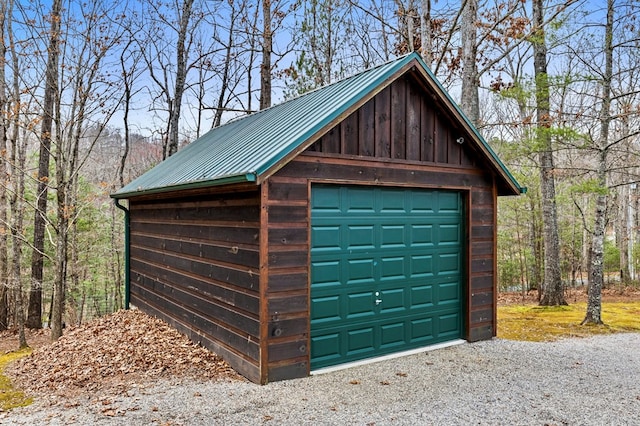 detached garage featuring driveway