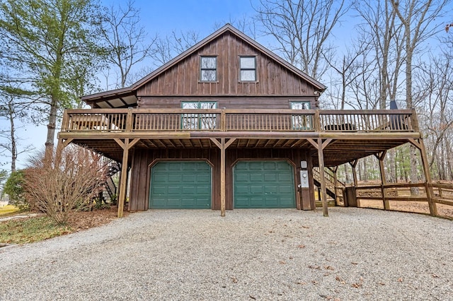 rustic home with stairs, gravel driveway, and a garage