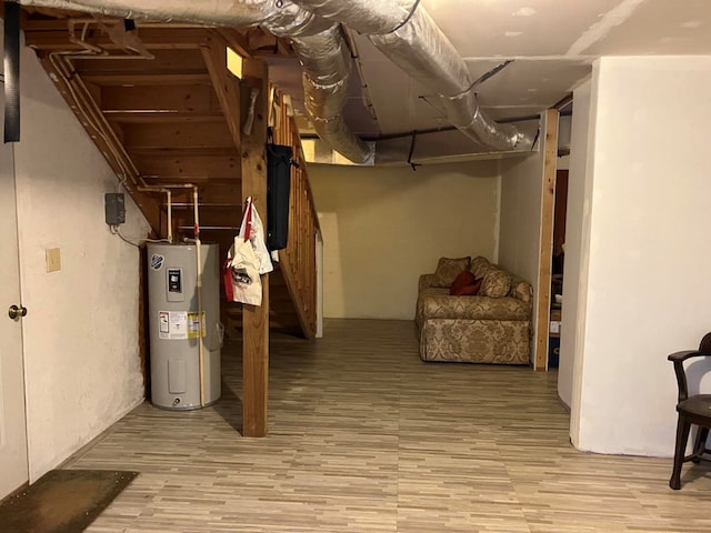 147 Holly Ridge Ln, Murphy, NC 28906 - basement featuring electric water heater and light hardwood / wood-style flooring