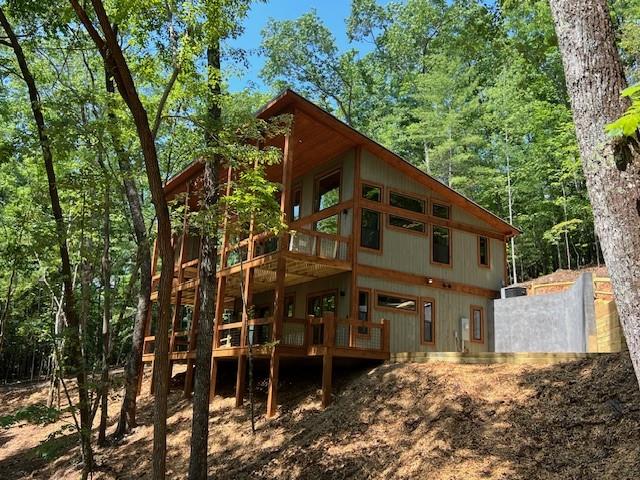 back of house featuring a deck