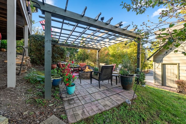 view of patio featuring an outdoor fire pit and a pergola