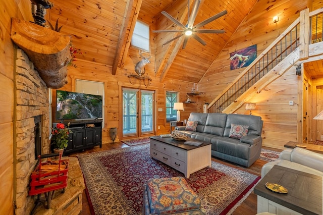 living room with high vaulted ceiling, wooden ceiling, dark hardwood / wood-style floors, and a stone fireplace