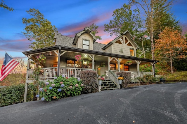 country-style home with a porch