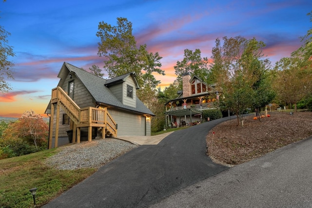 log-style house featuring a garage