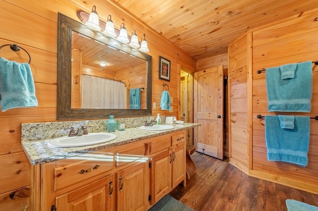 bathroom with curtained shower, wood-type flooring, vanity, wood walls, and wooden ceiling