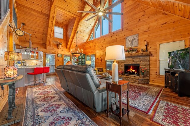 living room featuring high vaulted ceiling, wooden ceiling, dark hardwood / wood-style flooring, and a stone fireplace