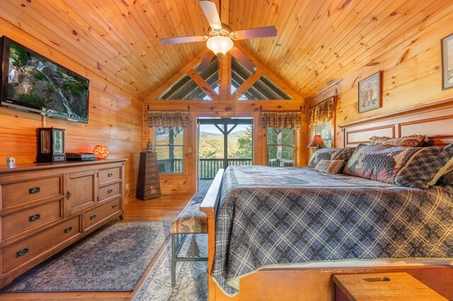 bedroom with light hardwood / wood-style floors, wooden ceiling, lofted ceiling, and access to outside