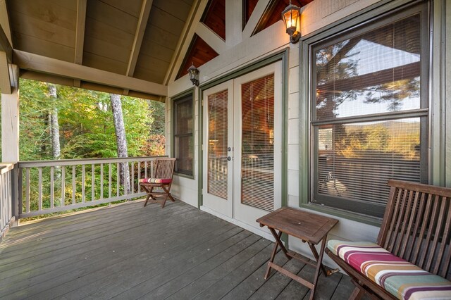 wooden deck featuring french doors