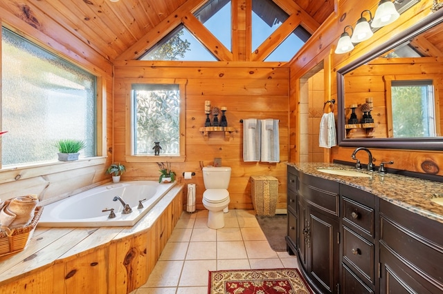 bathroom with toilet, wooden walls, tile patterned floors, vanity, and vaulted ceiling