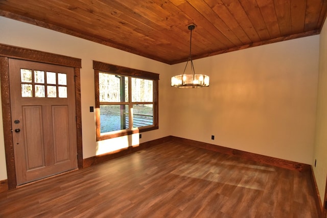 foyer with crown molding, wooden ceiling, dark wood-type flooring, and an inviting chandelier