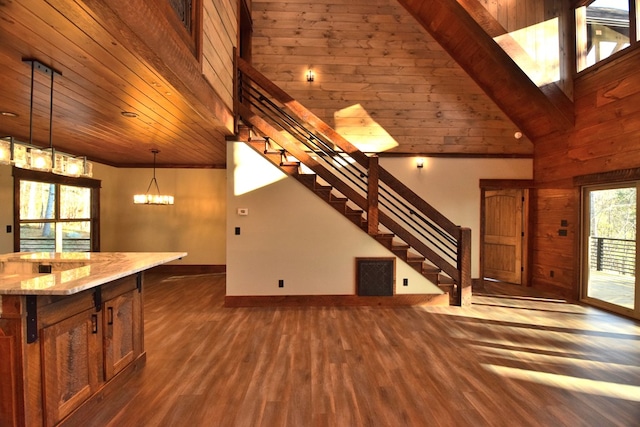 kitchen with light stone counters, wood ceiling, dark wood-type flooring, high vaulted ceiling, and hanging light fixtures