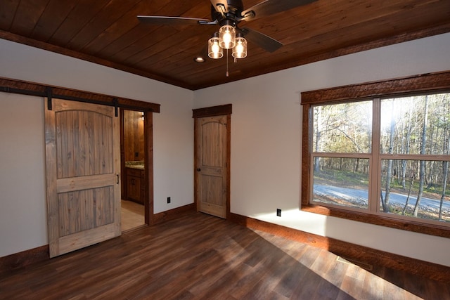 unfurnished bedroom featuring connected bathroom, ceiling fan, wood ceiling, and dark hardwood / wood-style floors