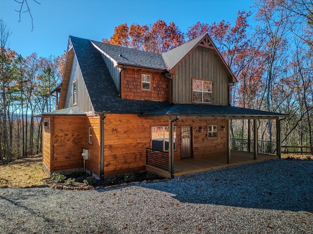 view of property exterior with covered porch