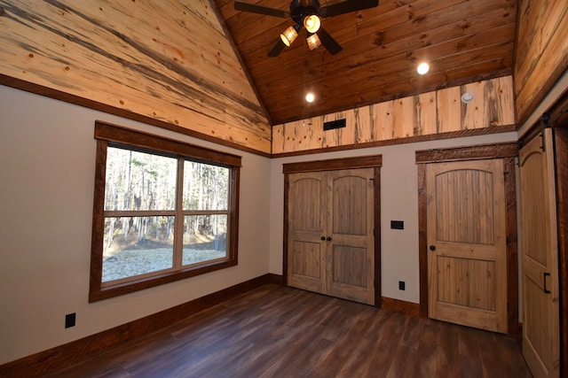 unfurnished bedroom with ceiling fan, dark hardwood / wood-style flooring, wood ceiling, and high vaulted ceiling