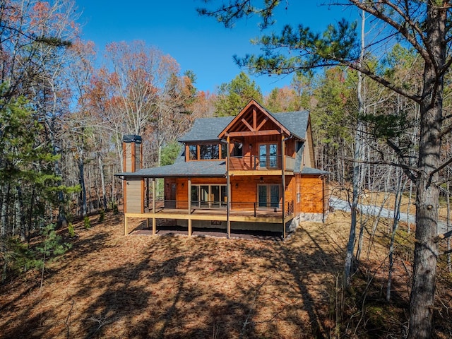 back of property with a balcony