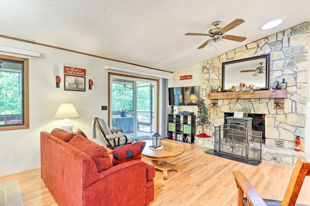 34 Clover Ln, Murphy, NC 28906 - living room with ceiling fan, wood finished floors, a textured ceiling, a fireplace, and crown molding
