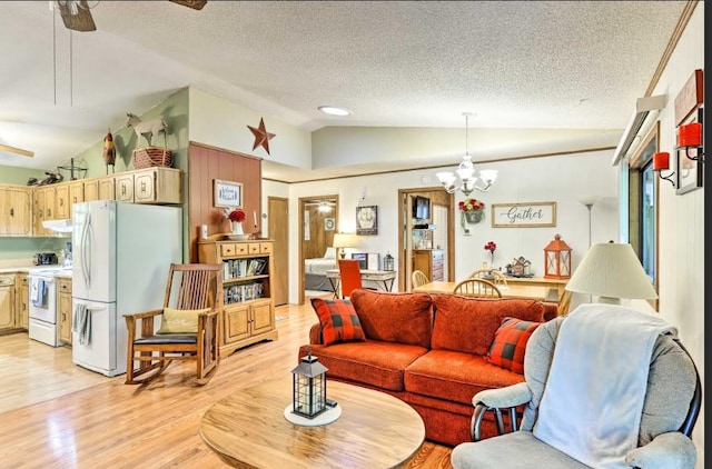 34 Clover Ln, Murphy, NC 28906 - living area with vaulted ceiling, light wood-type flooring, a textured ceiling, a chandelier, and a ceiling fan