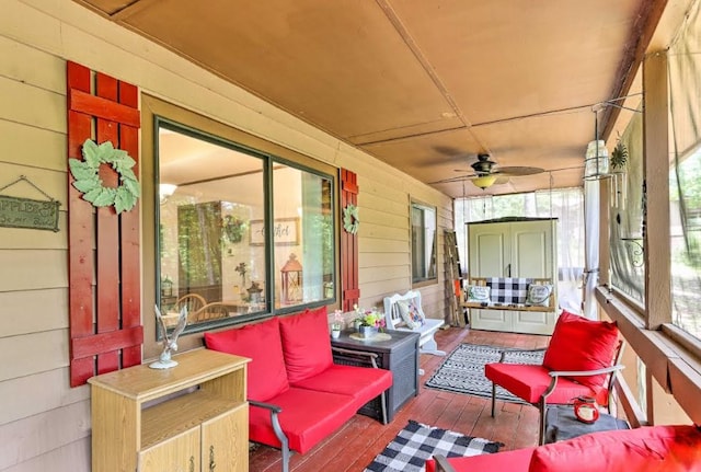 34 Clover Ln, Murphy, NC 28906 - sunroom / solarium featuring wood-type flooring, wood walls, ceiling fan, and an outdoor hangout area