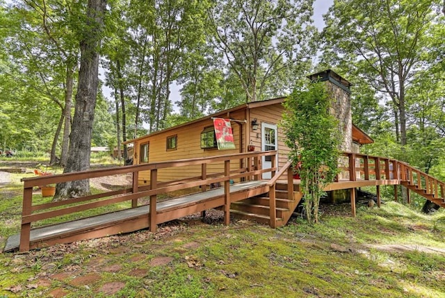 34 Clover Ln, Murphy, NC 28906 - rear view of property featuring a deck, stairs, and a chimney